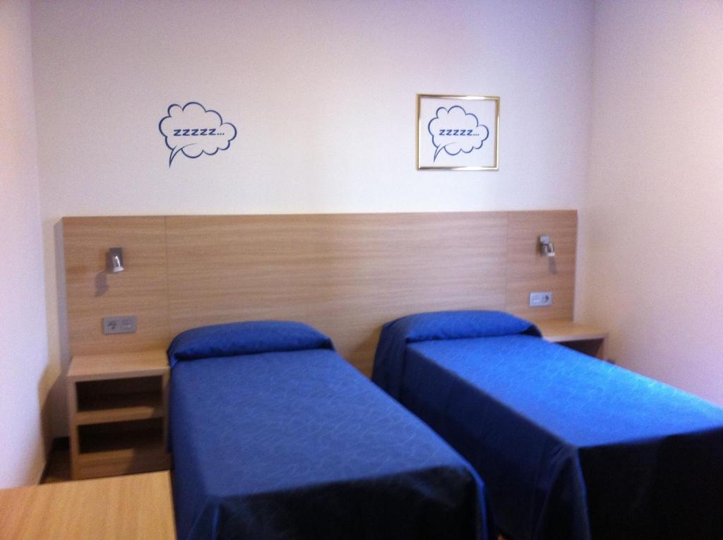 Postel nebo postele na pokoji v ubytování Hotel Mediterrani Express
