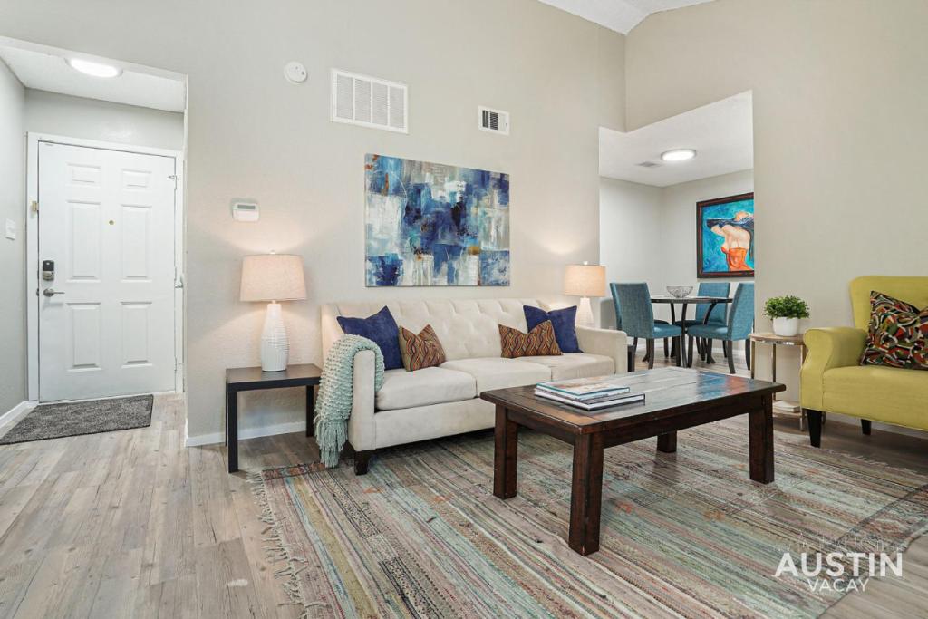 a living room with a couch and a coffee table at Everything You Need Near S Lamar Perfect Condo in Austin