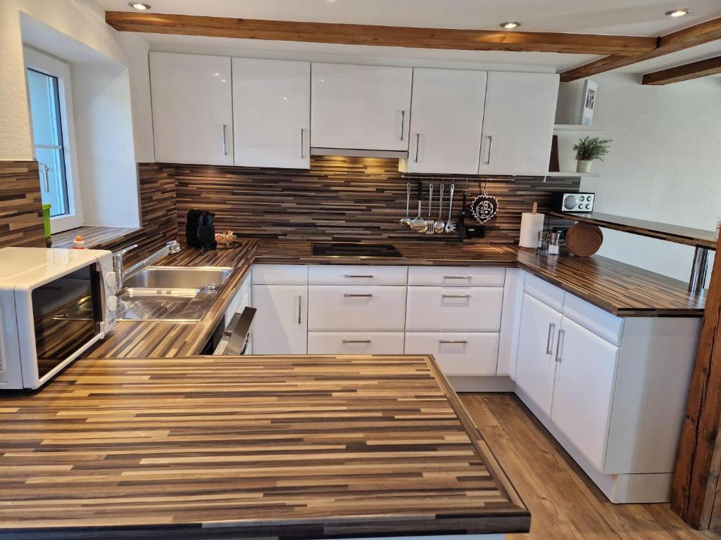 Kuchyň nebo kuchyňský kout v ubytování Ferienhaus Kluser