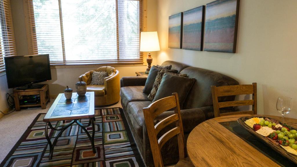 a living room with a couch and a table at Ski Trails 4113 in Truckee