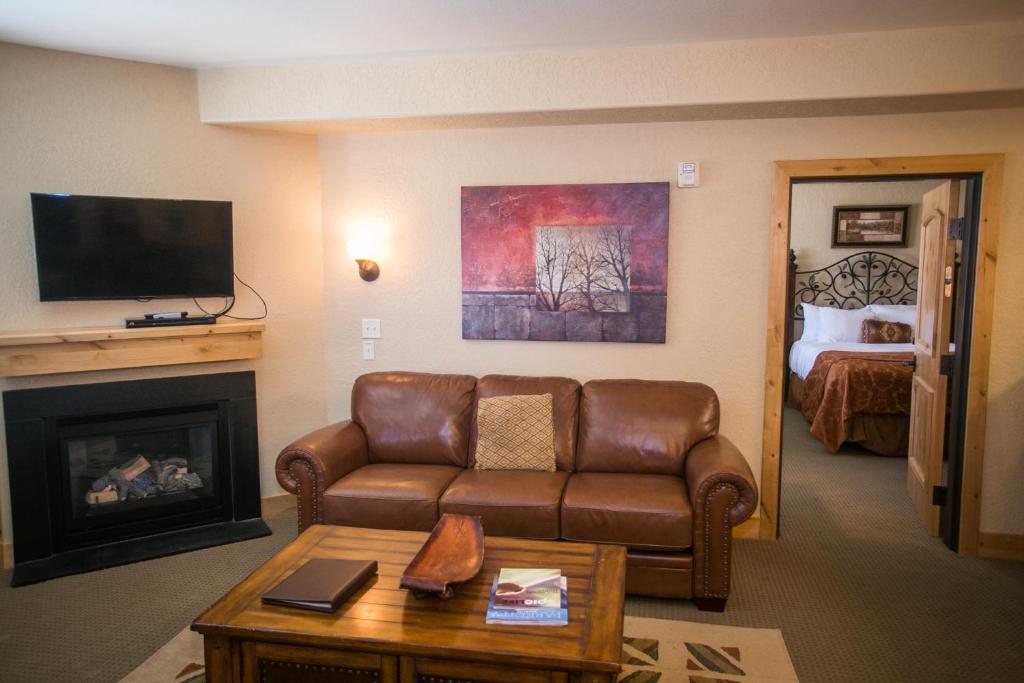 a living room with a couch and a fireplace at Silverado 312D in Park City