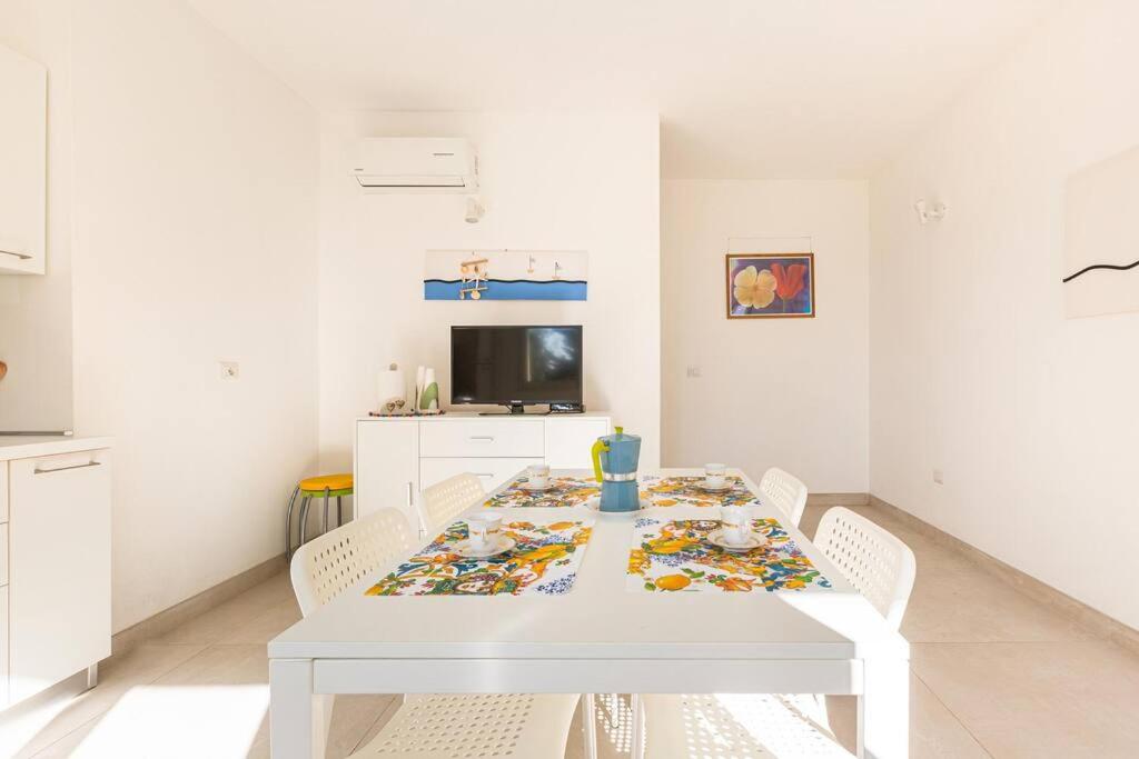 TV a/nebo společenská místnost v ubytování Salentoandmore - Appartamento Torre Pali