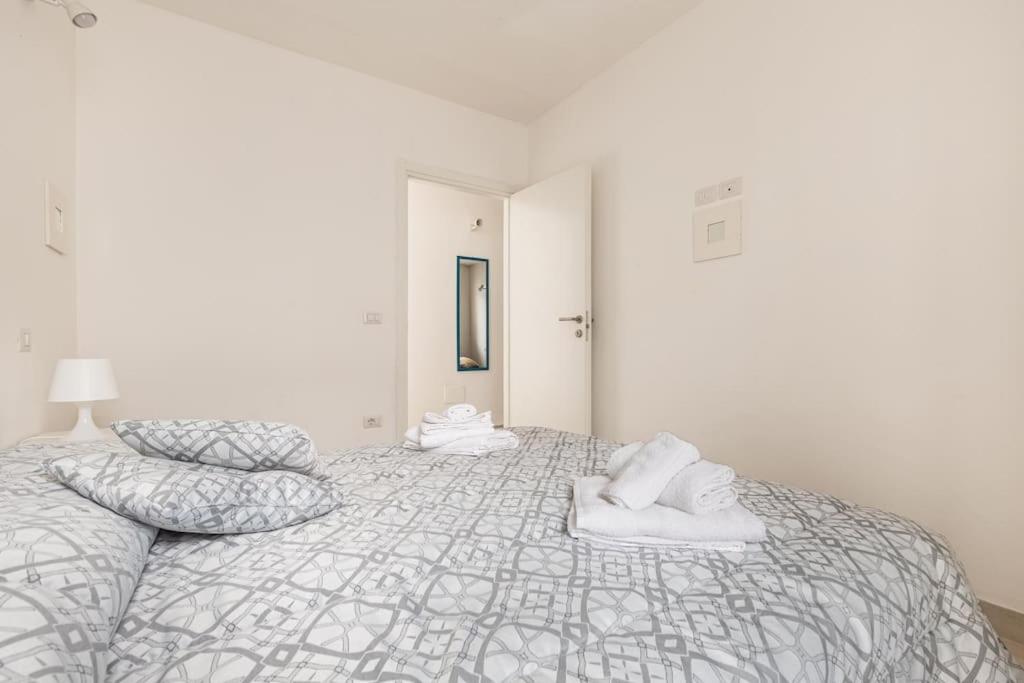 Postel nebo postele na pokoji v ubytování Salentoandmore - Appartamento Torre Pali