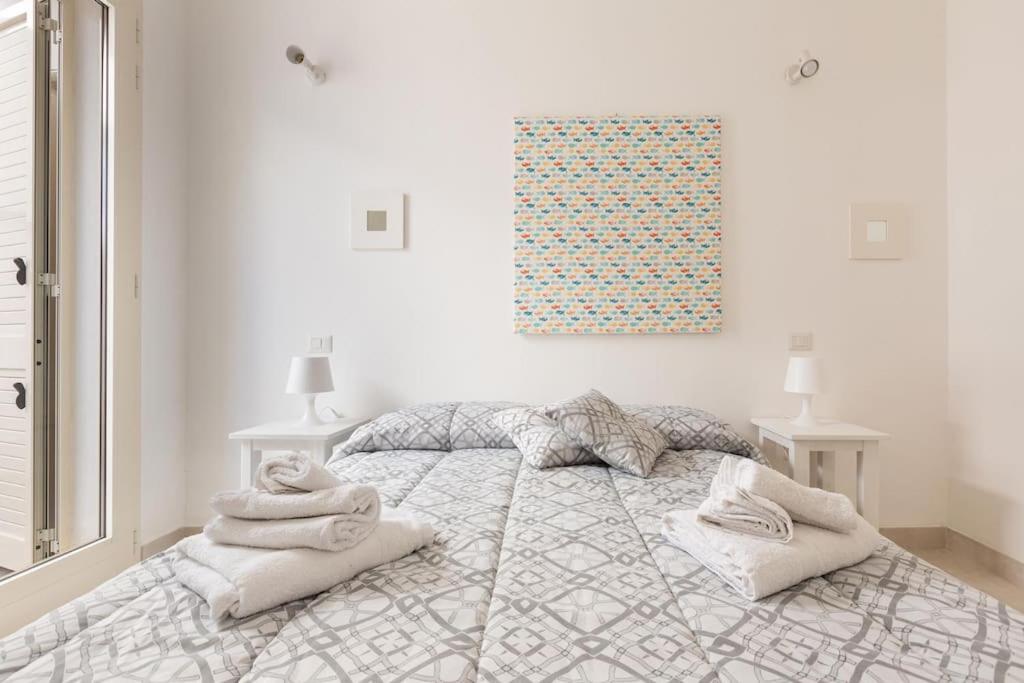 Postel nebo postele na pokoji v ubytování Salentoandmore - Appartamento Torre Pali