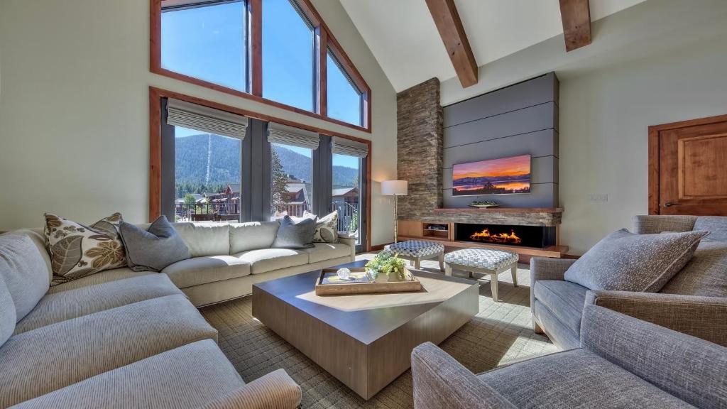 a living room with couches and a table and a fireplace at Zalanta 317 in South Lake Tahoe