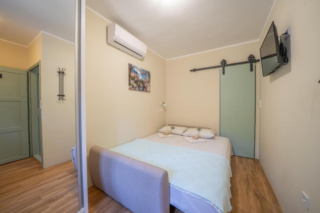 Postel nebo postele na pokoji v ubytování Apartmani Zukic