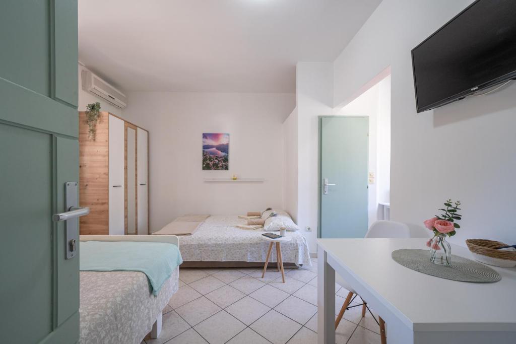 Postel nebo postele na pokoji v ubytování Apartmani Zukic