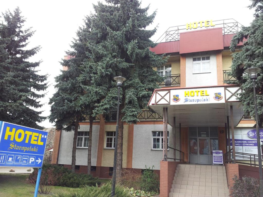 a hotel with a sign in front of it at Hotel Staropolski in Strzelce Krajeńskie