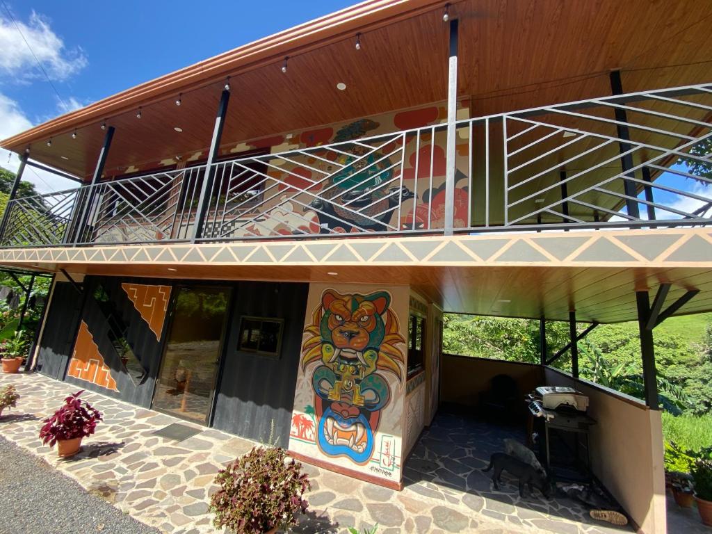 a house with a mural on the side of it at Indigo Container House in San Luis