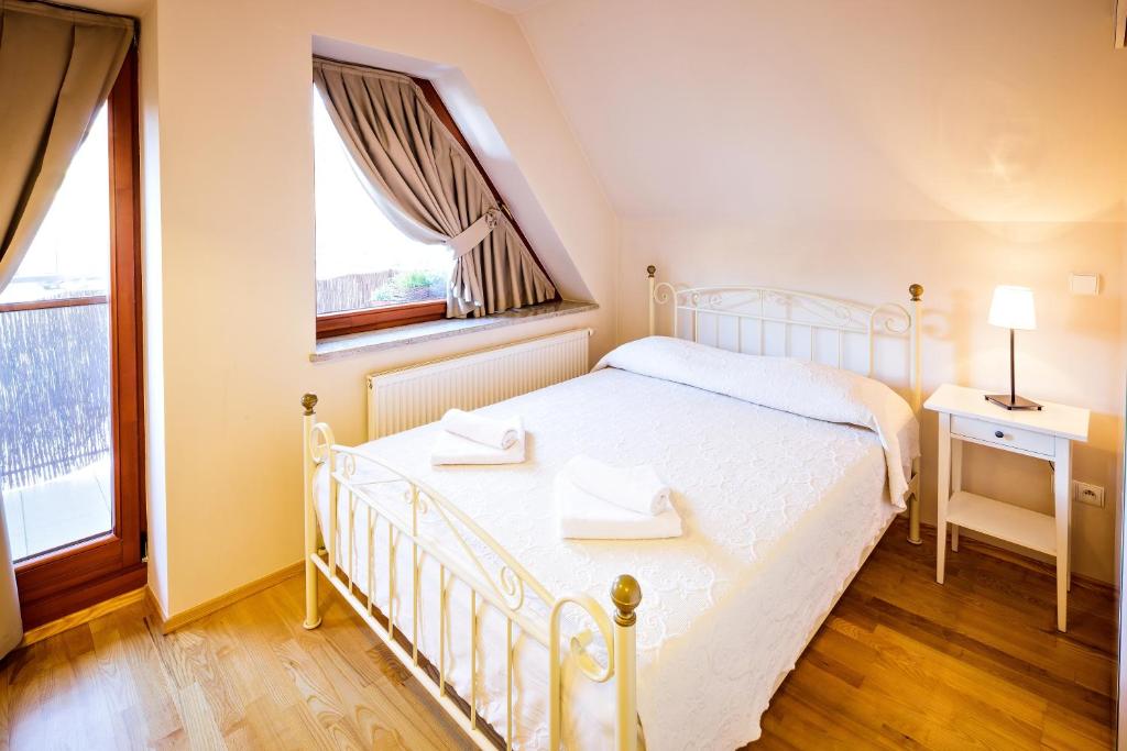 Posteľ alebo postele v izbe v ubytovaní Zakopane Apartamenty LUX
