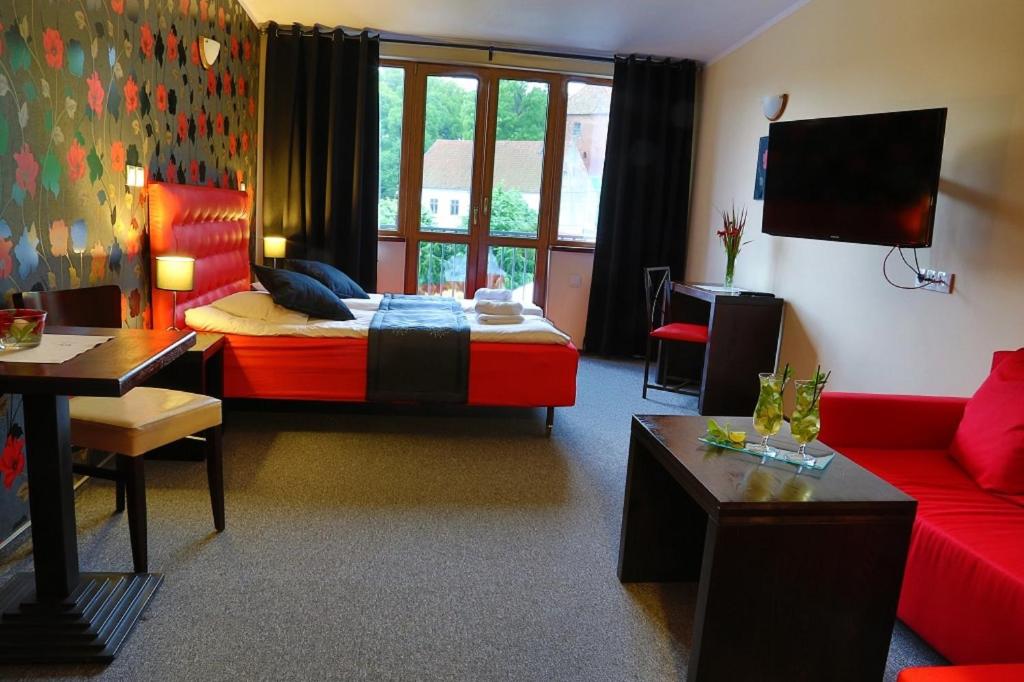 TV a/nebo společenská místnost v ubytování Pod Wzgórzem Bed & Breakfast