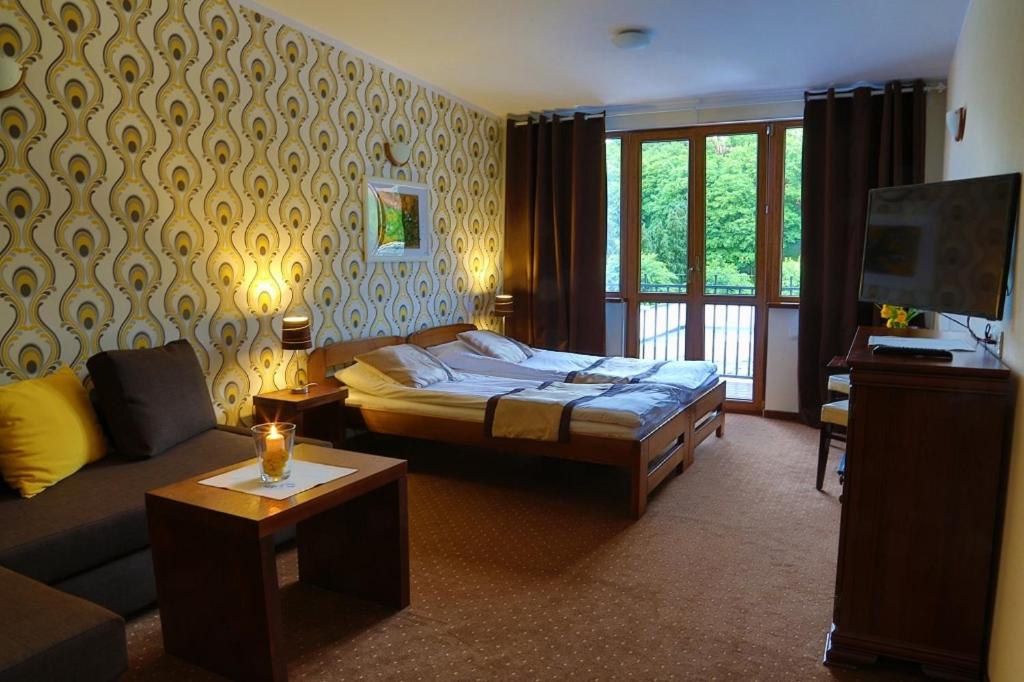 Postel nebo postele na pokoji v ubytování Pod Wzgórzem Bed & Breakfast