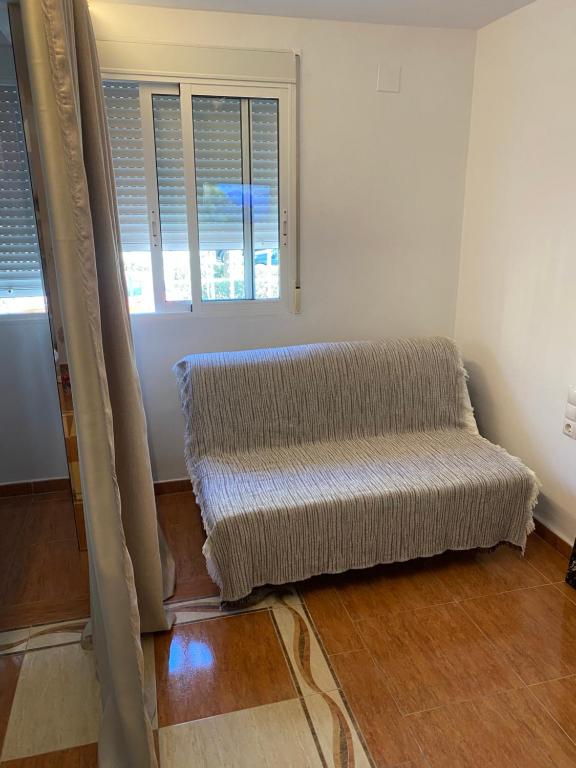 Posezení v ubytování Habitaciones con baño y cocina privada