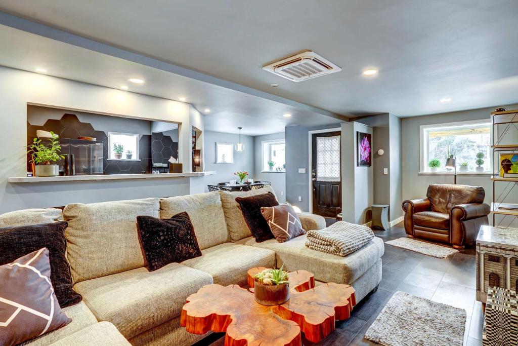 a living room with a couch and a chair at Pet-Friendly Dryden Vacation Rental! 