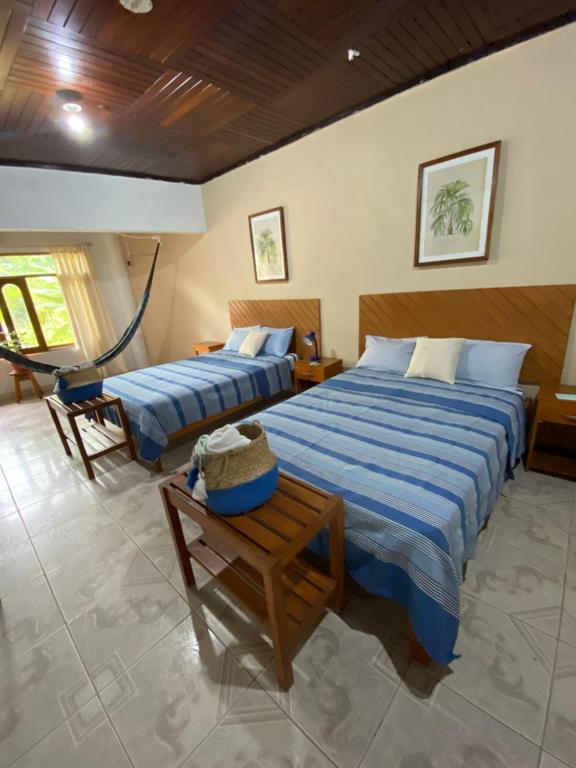 Postel nebo postele na pokoji v ubytování Poseidon Guest House