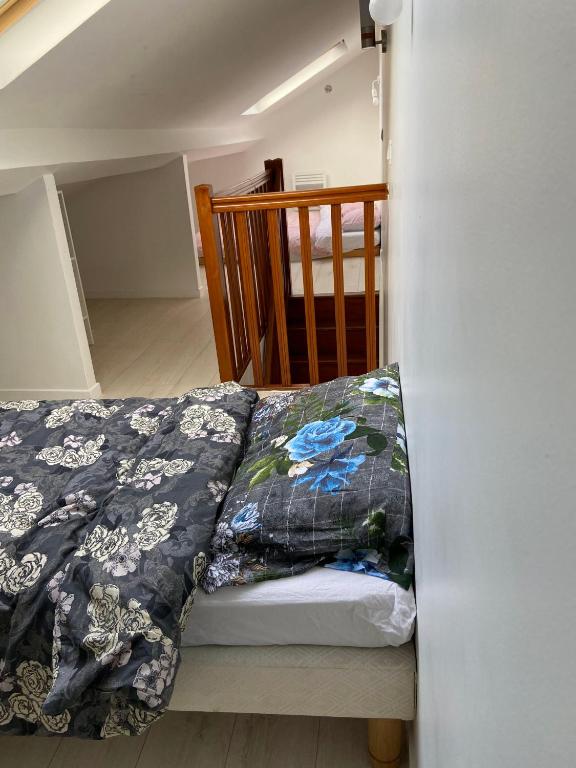 Posteľ alebo postele v izbe v ubytovaní Appart95 Saint-Brice CDG France