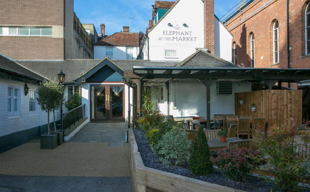 a building with a porch and a garden in front of it at The Elephant at the Market in Newbury