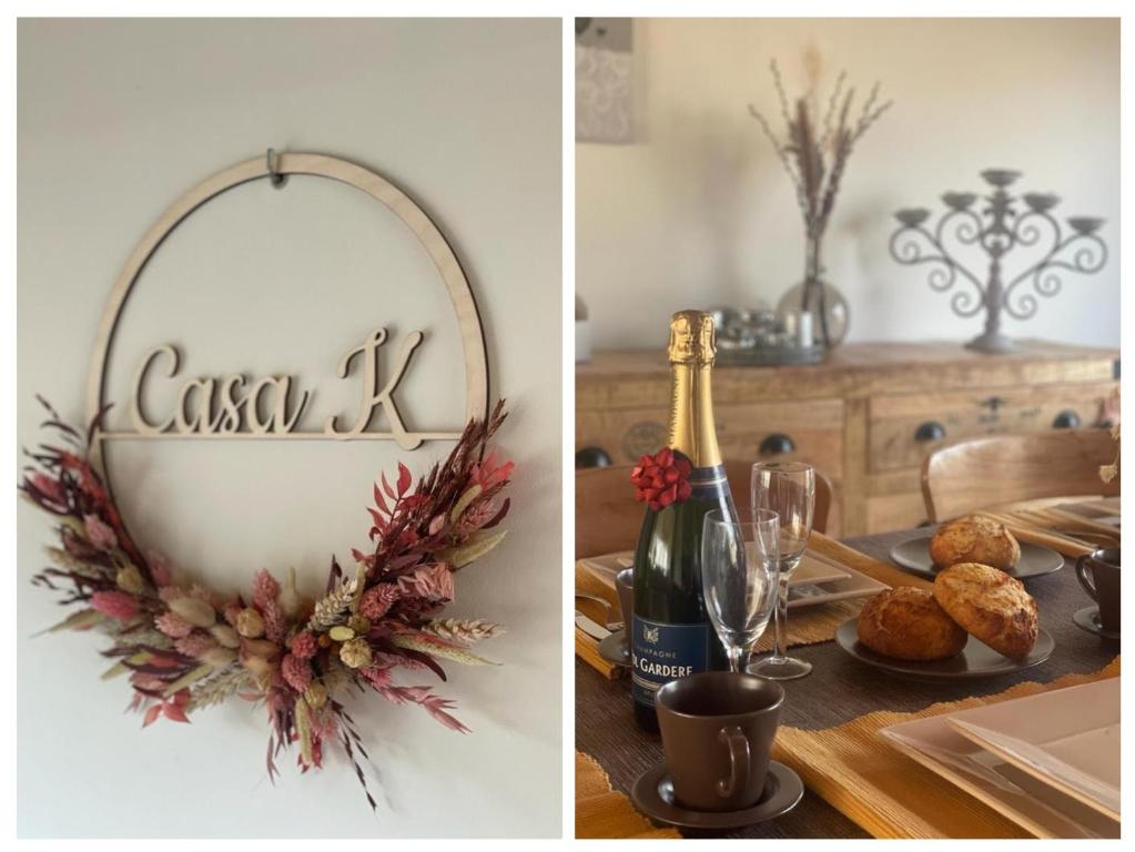 a dining room table with a christmas wreath and a wine bottle at Casa K in Middelkerke