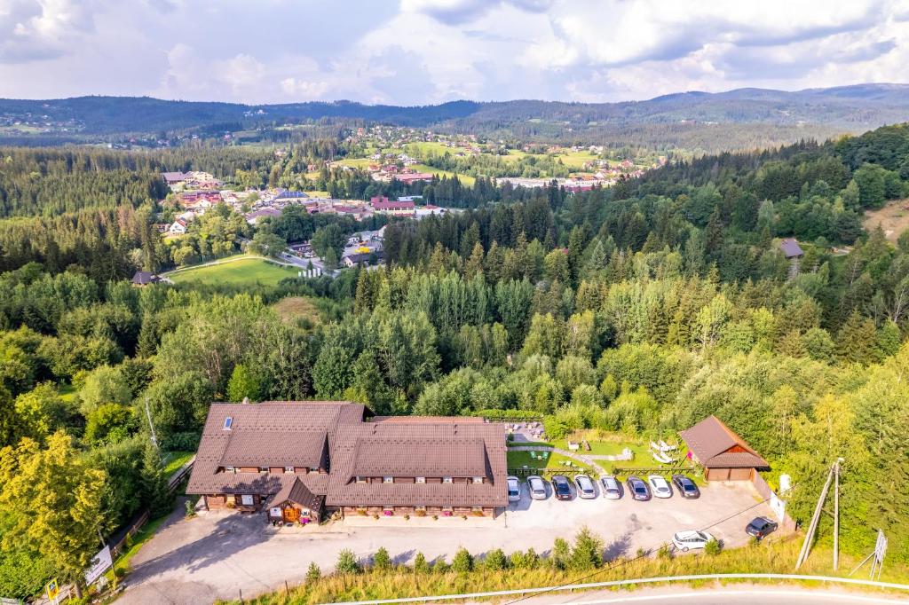 an aerial view of a house in a forest at Czarna Owca in Istebna