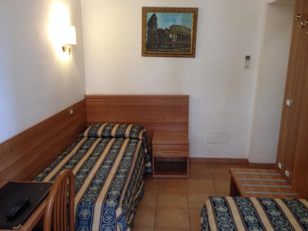 Postel nebo postele na pokoji v ubytování Hotel Bolognese
