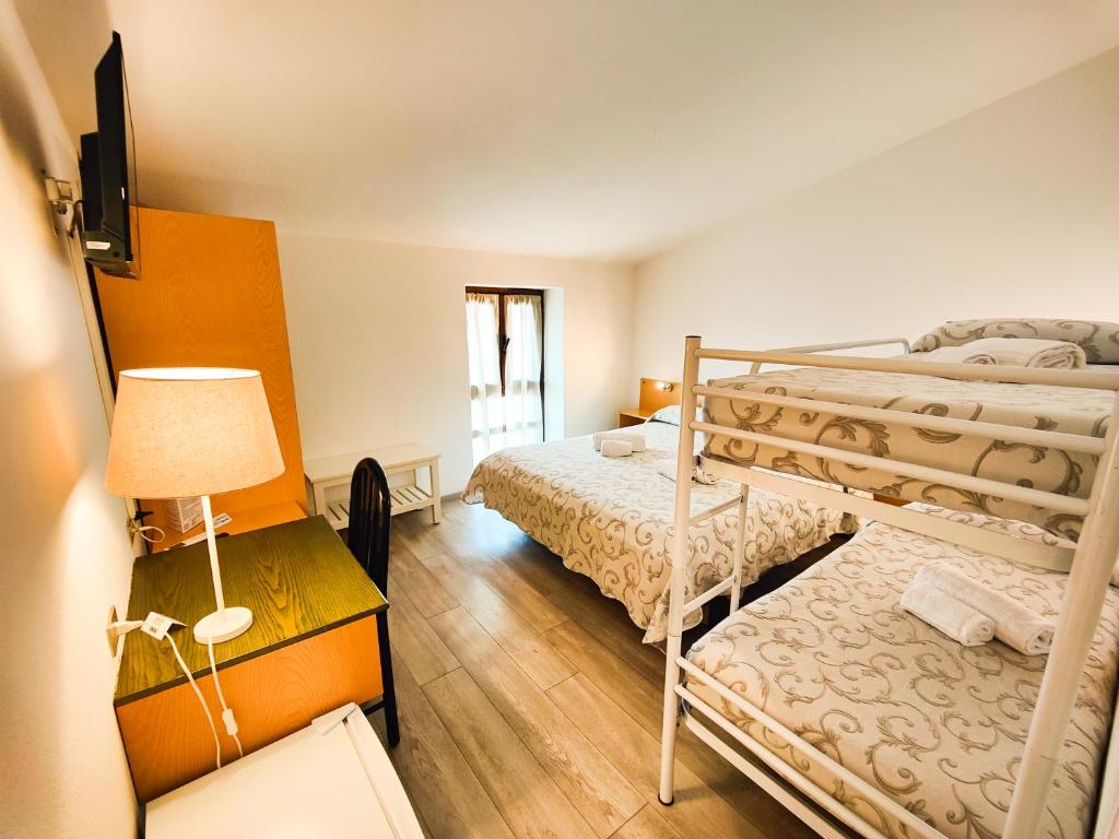 Postel nebo postele na pokoji v ubytování Albergo B&B Tenesi