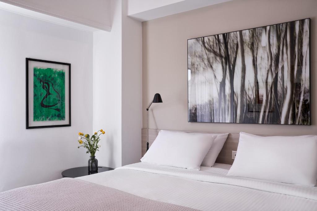A bed or beds in a room at Parthenon Apartment