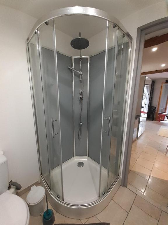 a shower stall in a bathroom with a toilet at Orry d'Oriège in Ax-les-Thermes