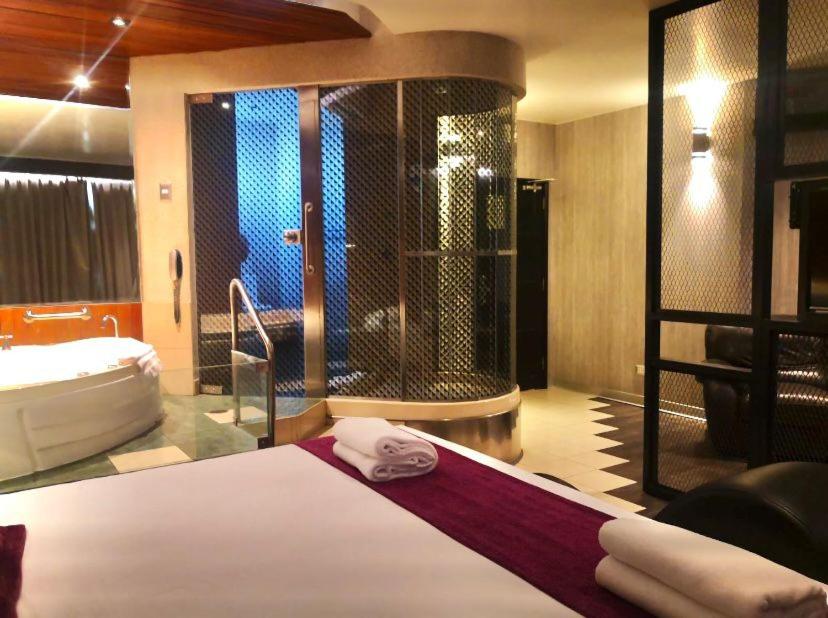 Postel nebo postele na pokoji v ubytování Hotel Las Lomas