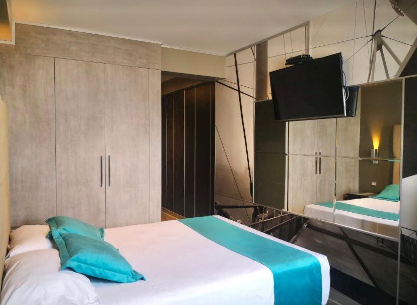 Postel nebo postele na pokoji v ubytování Hotel Las Lomas