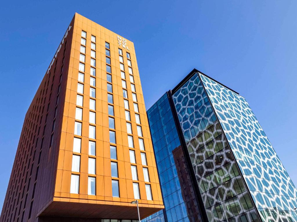 two tall buildings are next to each other at Novotel Liverpool Paddington Village in Liverpool