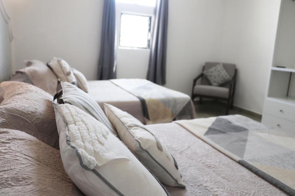 Postel nebo postele na pokoji v ubytování Hotel Plaza San Juan