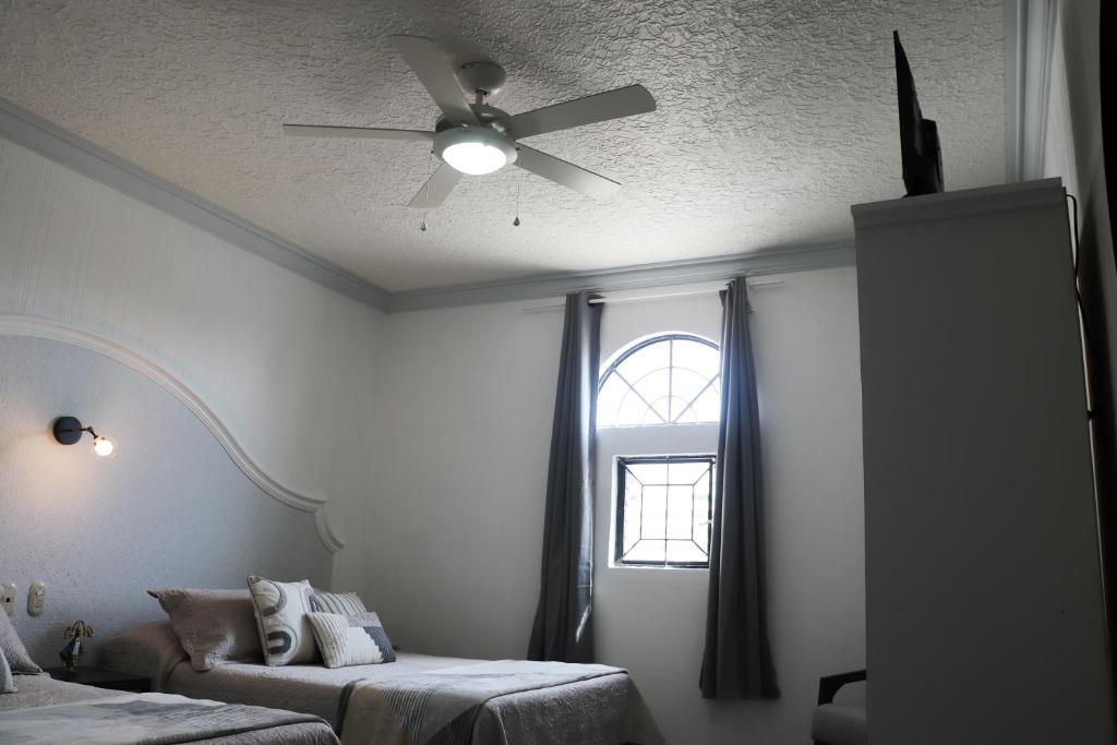 Postel nebo postele na pokoji v ubytování Hotel Plaza San Juan