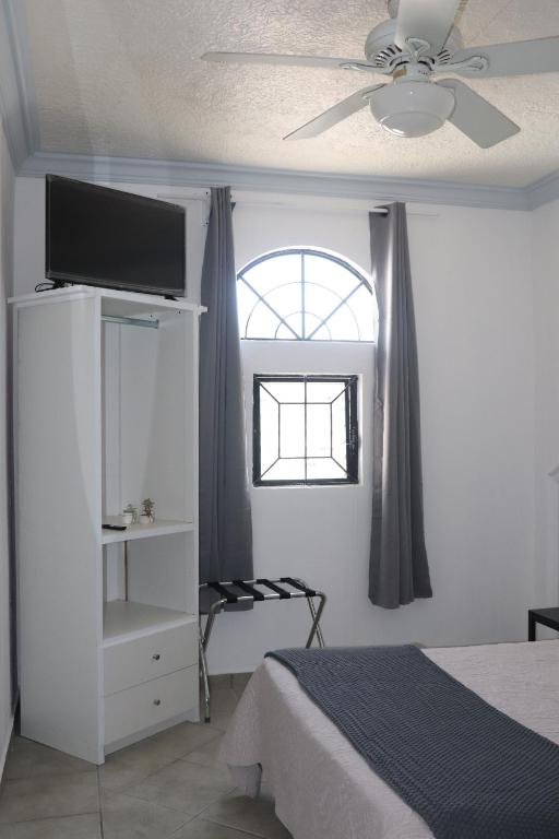 Postel nebo postele na pokoji v ubytování Hotel Plaza San Juan