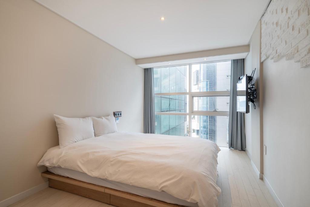 Postel nebo postele na pokoji v ubytování Elysia Boutique Hotel