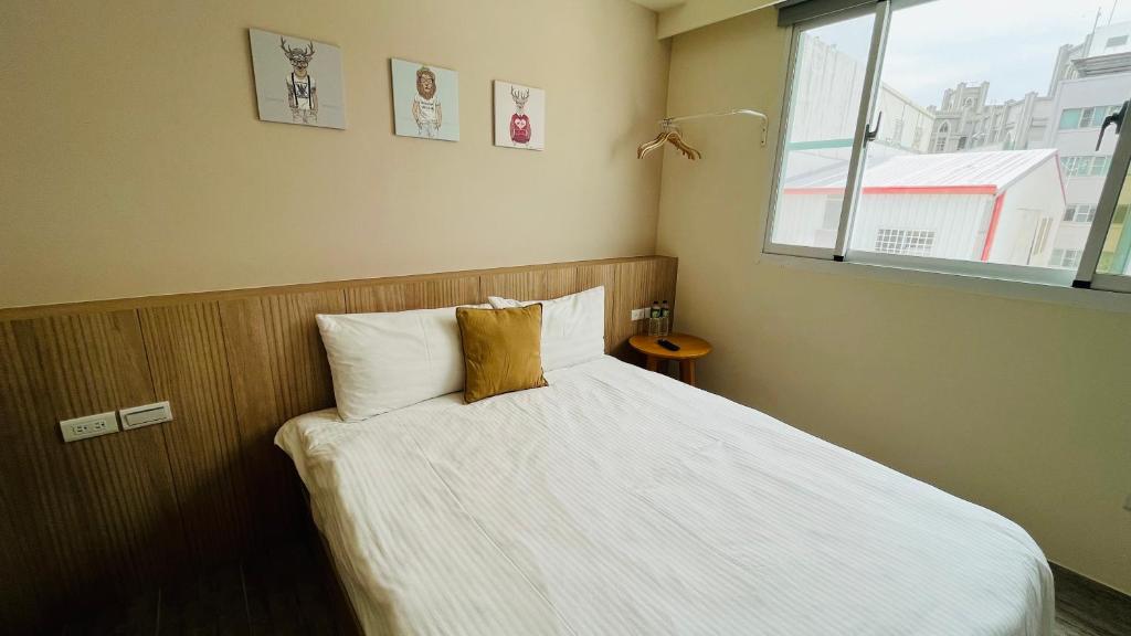 Postel nebo postele na pokoji v ubytování 古栗Chestnut Guest House-可包棟民宿