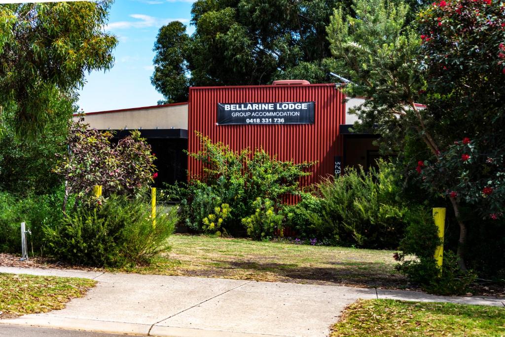 a red building with a sign that reads valhalla coffee at Bellarine Lodge Sleeps 30 in Drysdale