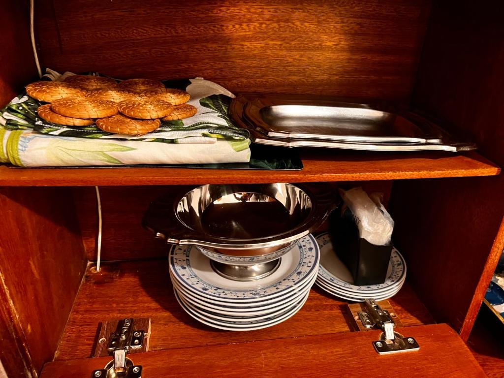a shelf with plates and a bowl of food at Copacabana in Beach in Rio de Janeiro