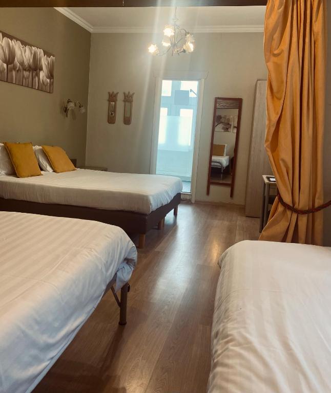 Postel nebo postele na pokoji v ubytování New Hotel de Lives