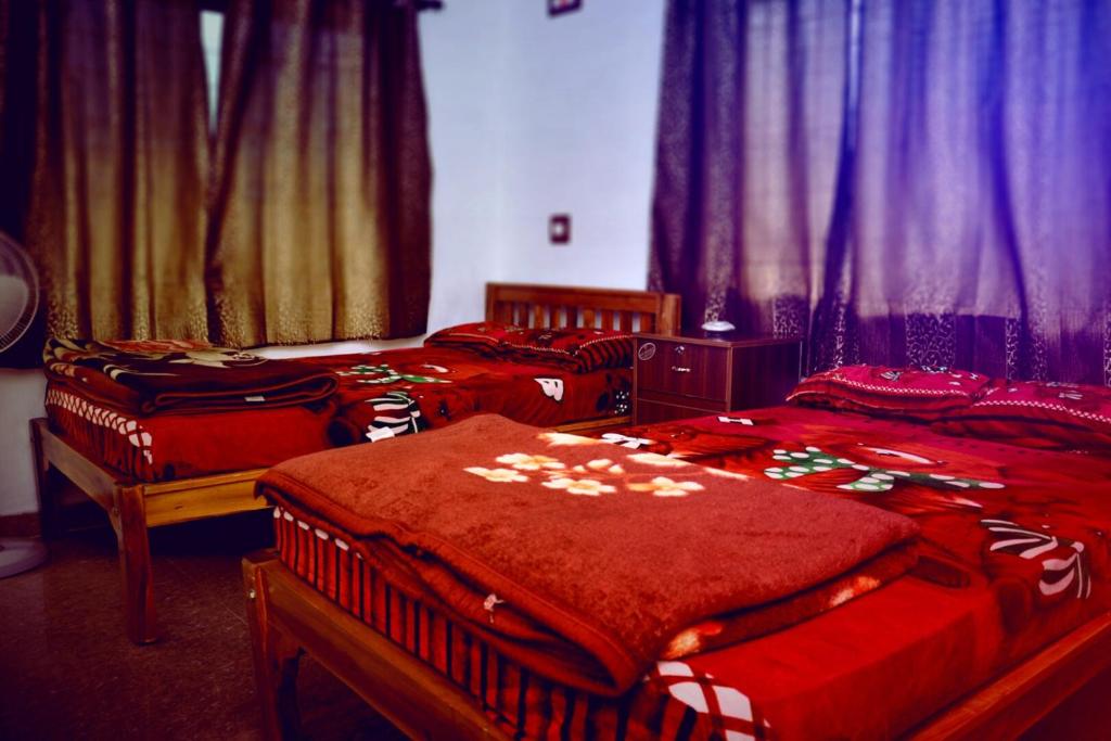 Postel nebo postele na pokoji v ubytování REST POINT HOMESTAY