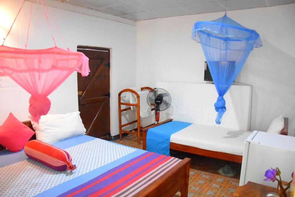 Postel nebo postele na pokoji v ubytování S P City Resort