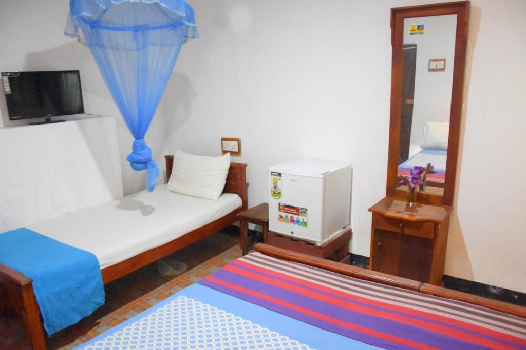 Postel nebo postele na pokoji v ubytování S P City Resort