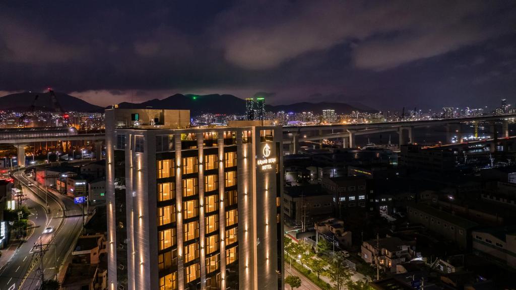 a view of a city at night at Yeongdo Grandbern Hotel in Busan