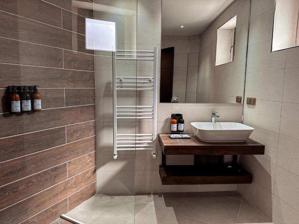 a bathroom with a sink and a mirror at Osmanli Cappadocia Hotel in Göreme