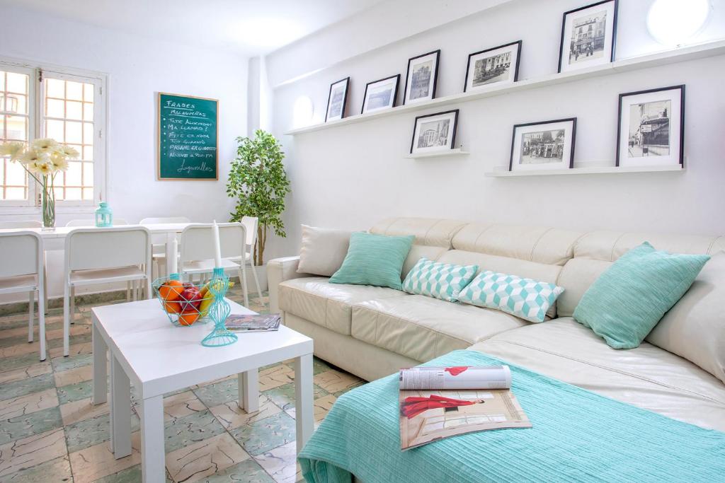 a living room with a couch and a table at BIG FLAT IN CITY CENTER, UP To 12 PEOPLE in Málaga