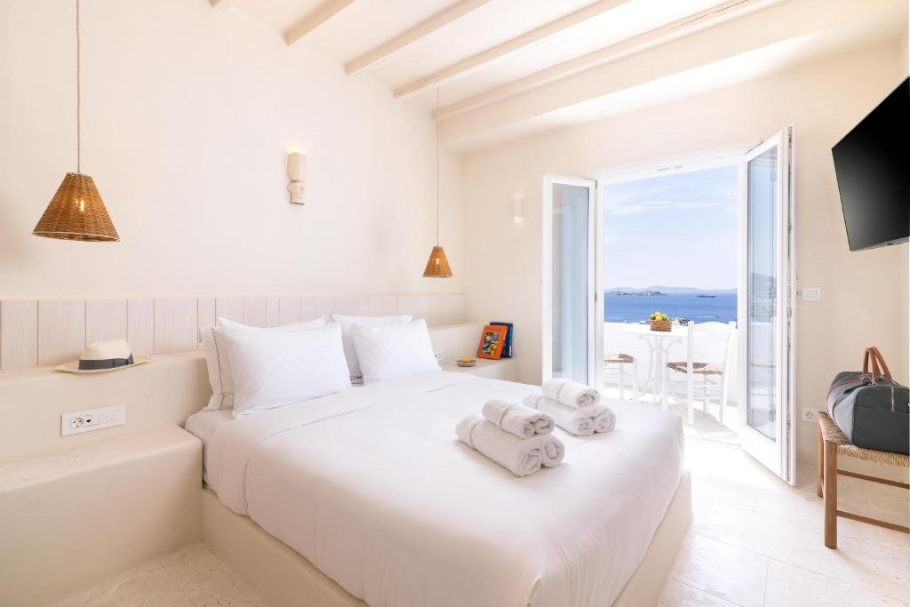 Posteľ alebo postele v izbe v ubytovaní Porto Mykonos