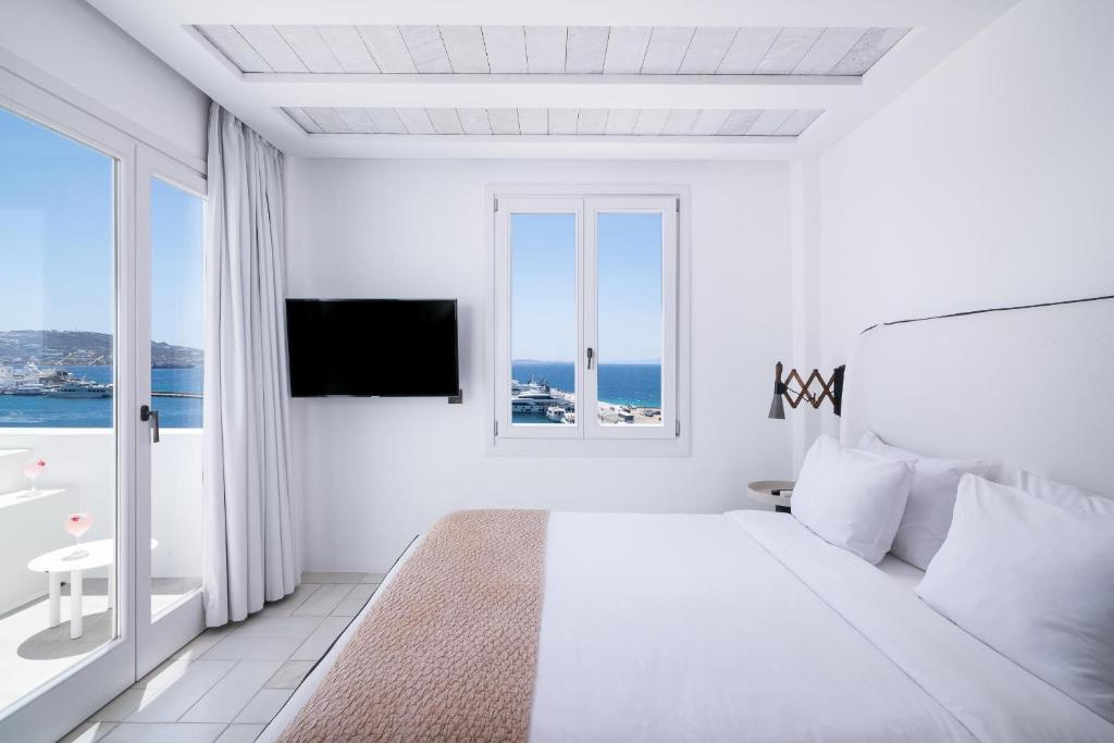 Posteľ alebo postele v izbe v ubytovaní Porto Mykonos