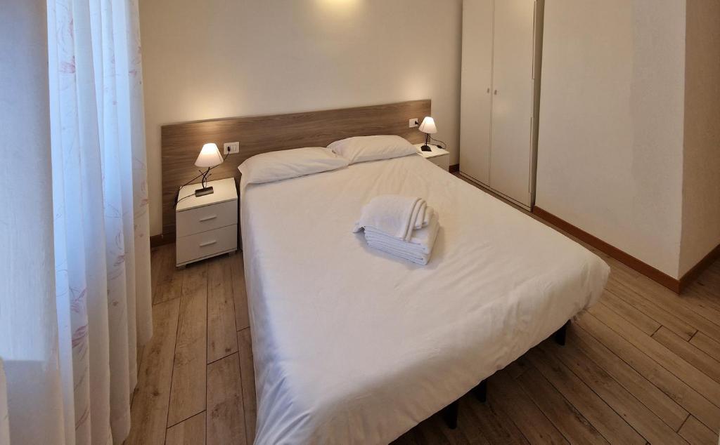 Postel nebo postele na pokoji v ubytování Hotel Beretta
