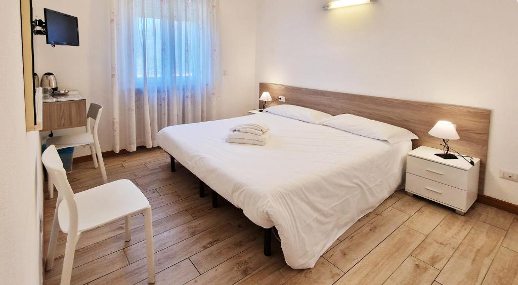 Postel nebo postele na pokoji v ubytování Hotel Beretta