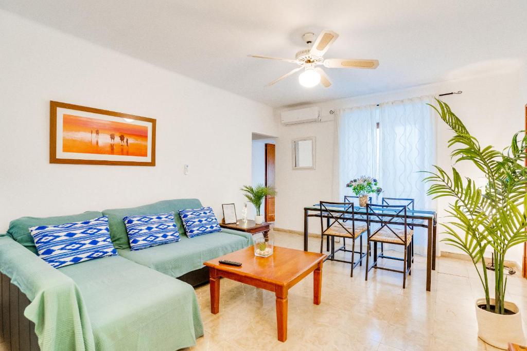 a living room with a couch and a table at Apartamento Es Celler in Alcudia