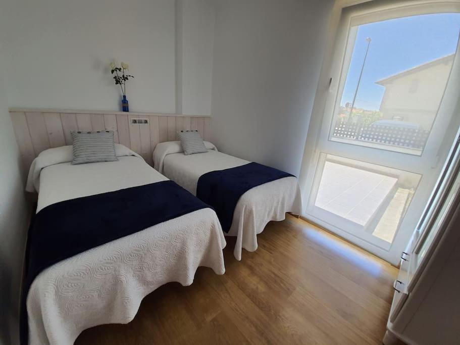 A bed or beds in a room at El Rincón de Gabriela